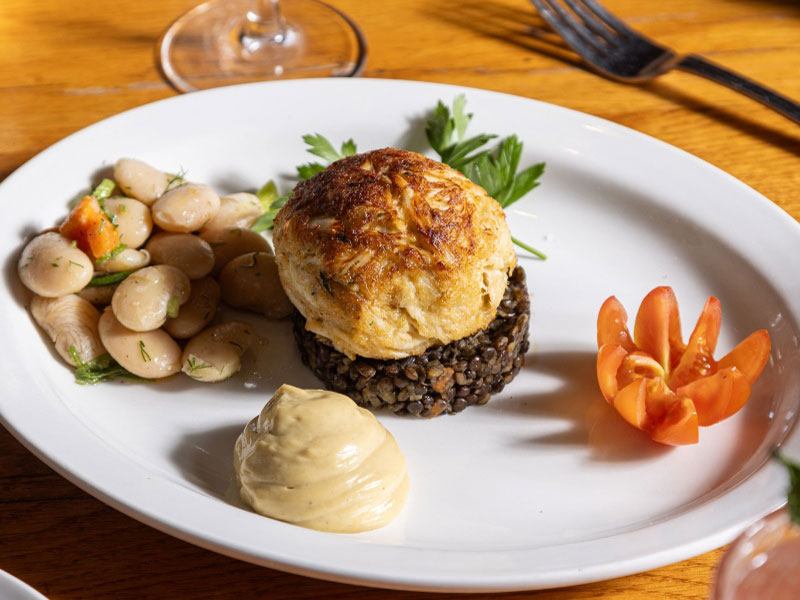 Colossal and jumbo lump crab, Beluga lentils, marinated gigandes, Dijon aioli